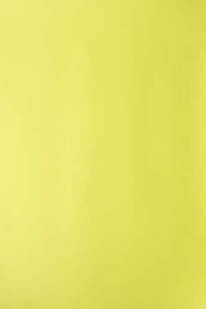 Yellow paper texture background, blank color backdropの写真素材