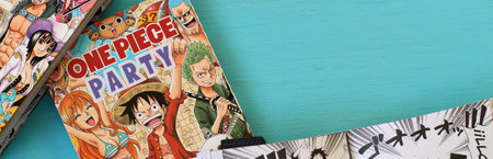One piece manga book in blue table, japanese comic style in Spanish, Vitoria, Spain, July of 2022のeditorial素材