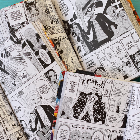 One piece manga book in blue table, japanese comic style in Spanish, Vitoria, Spain, July of 2022のeditorial素材