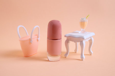 Beige bottle nail polish and mini furniture on studio backgroundの写真素材