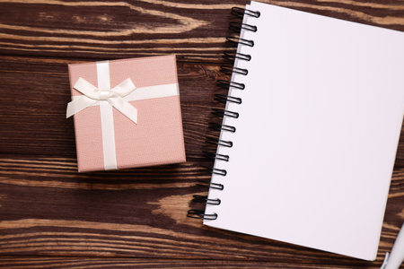 Present box on wooden background, gift package, copy spaceの写真素材