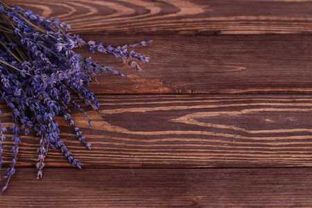 Bunch of lavender flowers on brown wooden background, copy spaceの写真素材