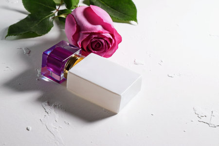 White perfume bottle with purple top, perfumery mockupの写真素材