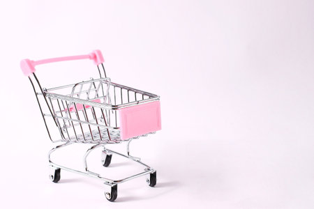 Mini shopping trolley on white backgroundの写真素材