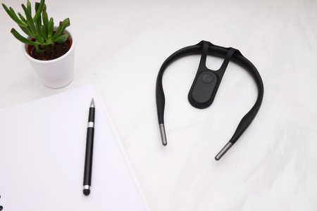 Smart posture corrector for spine on table, lifestyle staging, mockup