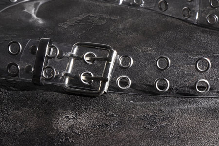 Transparent plastic belt with metal silver decor, clothes accessories