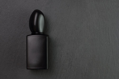 Black glass perfume bottle mockup on stone texture backgroundの写真素材