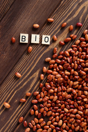 Red pea beans bio word on wooden backgroundの写真素材