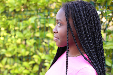 Black young girl with afro dreads hairstyle on the street