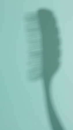 Hair brush skeleton formed shadow, blue hair accessories, copy spaceの写真素材