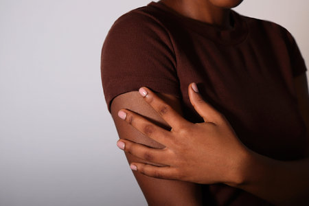 Afro young woman with nude manicure nailsの写真素材