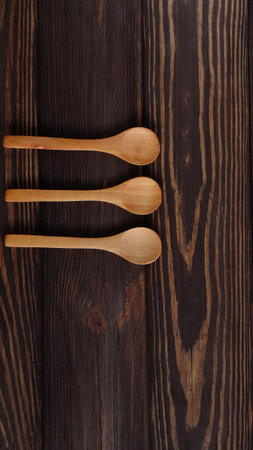Wooden natural spoons mockup on wood table, spoon templateの写真素材