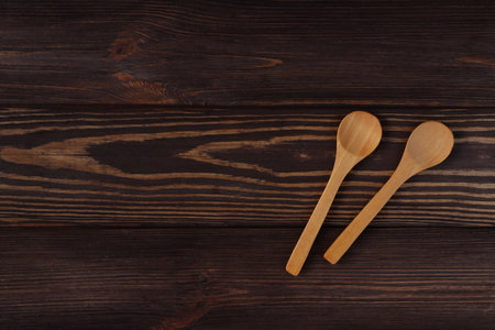 Wooden natural spoons mockup on wood table, spoon templateの写真素材