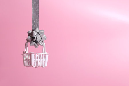 Empty mock up shopping basket with silver shiny ribbon, Christmas holiday template, winter saleの写真素材