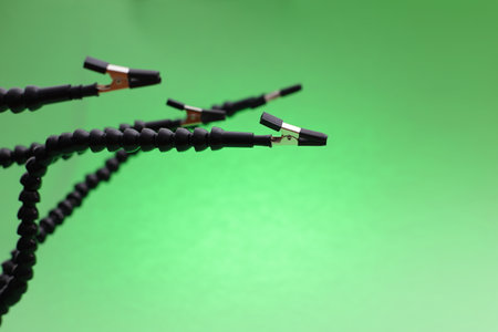 Third hand device for soldering clips holder on green backgroundの写真素材