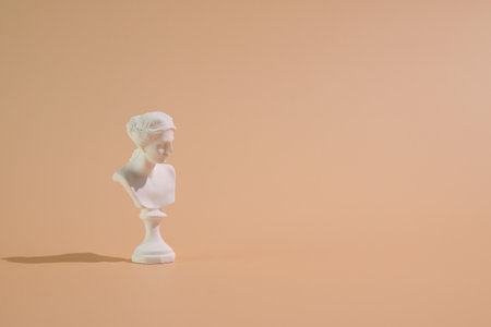 Marble head of young woman, greece sculpture bust on colorful background, copy spaceの写真素材