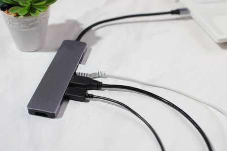 USB hub with cables plugging, electronic device, lifestyle