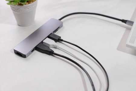 USB hub with cables plugging, electronic device, lifestyle