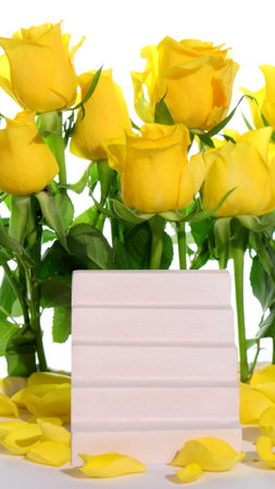 Product blank podium, cosmetic presentation platform, yellow roses on backgroundの写真素材