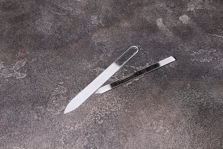 White glass nail file on black background, manicure nail hygiene conceptの写真素材