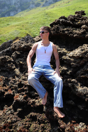 Young caucasian guy in sunglasses, casual teenager style, summer lifestyleの写真素材