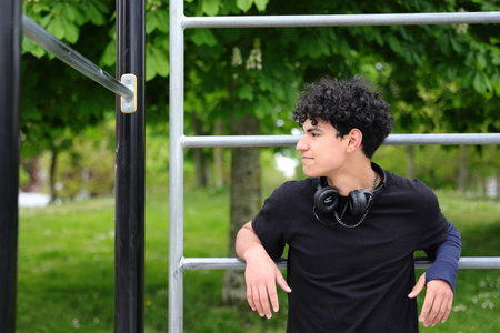 Young hispanic attractive teenager, guy portrait, street style