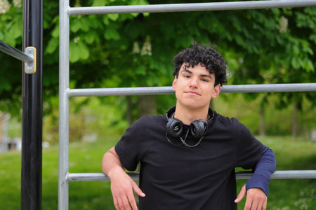 Young hispanic attractive teenager, guy portrait, street style