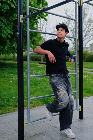Young hispanic attractive teenager, guy portrait, street style