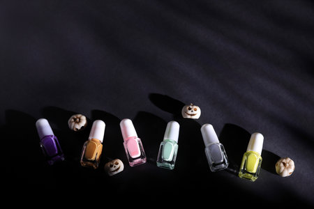 Halloween nail polish decoration, colorful bottles on black backgroundの写真素材