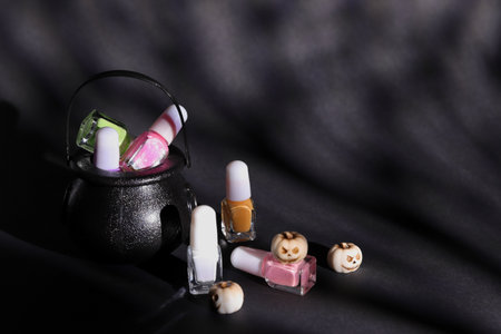 Halloween nail polish decoration, colorful bottles on black backgroundの写真素材