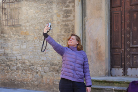 Solo travel, young female tourist, woman with a backpack traveling in Europe, Spain