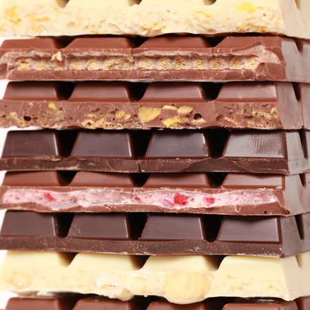 Different sorts of chocolate in a stackの写真素材
