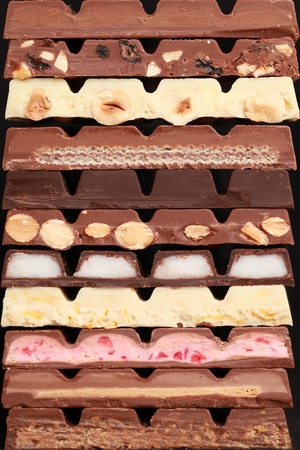 Different sorts of chocolate in a stackの写真素材