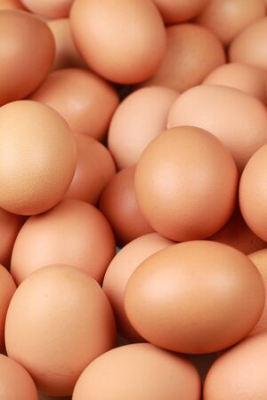 Brown eggs one upon the other with selective focus.の写真素材