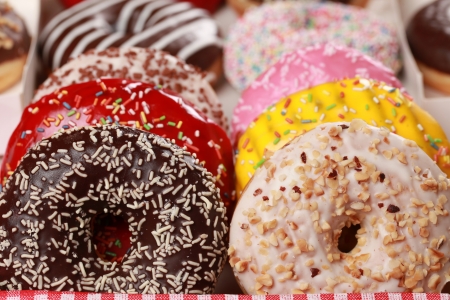 Collection of many colored donuts in a box