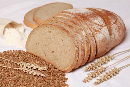 Wheat bread on a table cut on slicesの写真素材