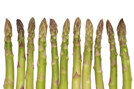 Close-up of fresh green asparagus isolated on white backgroundの写真素材