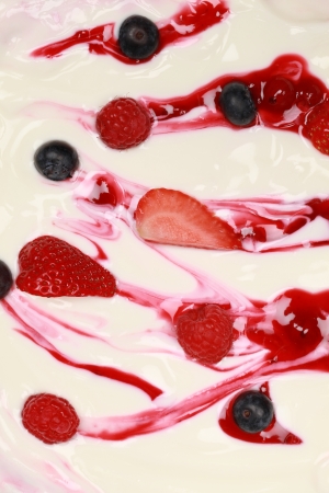Fresh milk yogurt with raspberries, strawberries and blueberriesの写真素材
