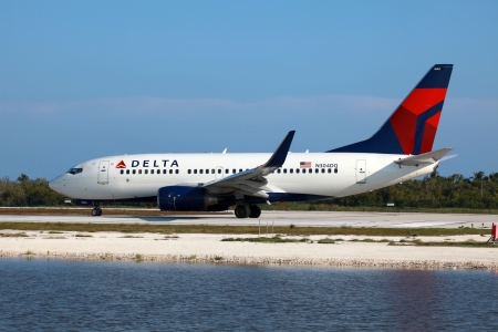 Key West, Florida - May 7, 2012: A Delta Air Lines Boeing 737-700 taxis on Key West Airport in Florida. Delta Air Lines is the world's largest airline with 710 planes and 111.1 million passengers in 2011. It is headquartered in Atlanta, Georgia, in the Un