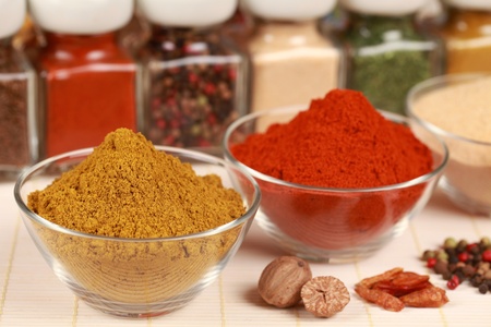 Various exotic spices in bowls  Selective focus on the curry powder の写真素材