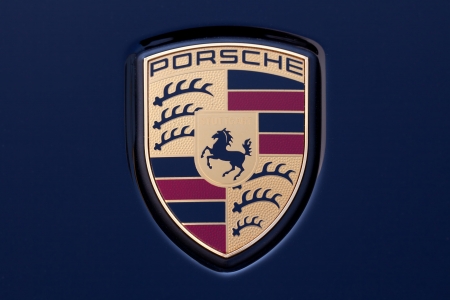 Stuttgart, Germany - September 4, 2012: Macro shot of the legendary Porsche emblem on a Porsche 911. Porsche is a German company with investments in the luxury automotive industry.のeditorial素材