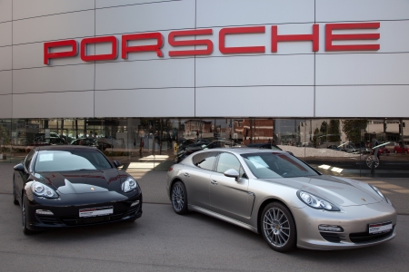 Stuttgart, Germany - September 4, 2012: Porsche Panamera sports cars in front of a Porsche dealer in Stuttgart Zuffenhausen. Porsche is a German company with investments in the luxury automotive industry.のeditorial素材