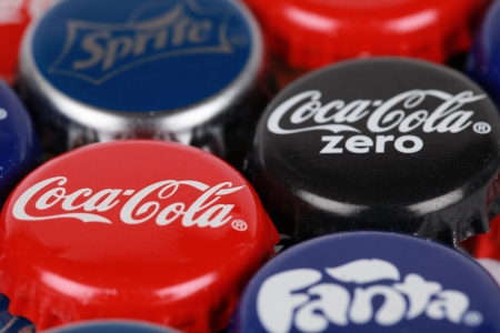 Stuttgart, Germany - October 6, 2012: Group of Coca-Cola, Coca-Cola Zero, Fanta and Sprite bottle caps. Macro shot with shallow depth of field. Stuttgart, Germany - October 6, 2012: Group of Coca-Cola, Coca-Cola Zero, Fanta and Sprite bottle caps. Macro shot with shallow depth of field.