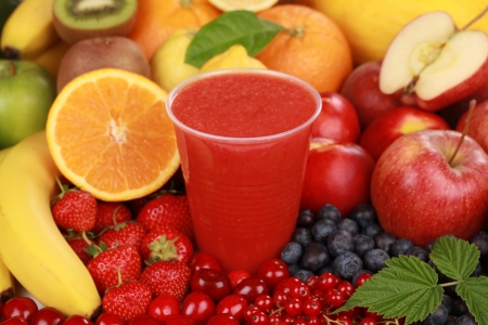 Freshly squeezed juice from red fruits in a cupの写真素材