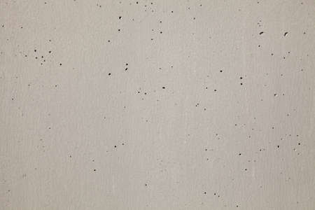 Concrete wall on a modern building forming a backgroundの写真素材
