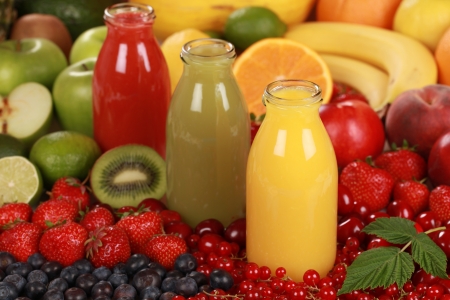 Fresh fruit juices made from red, green and orange fruitsの写真素材