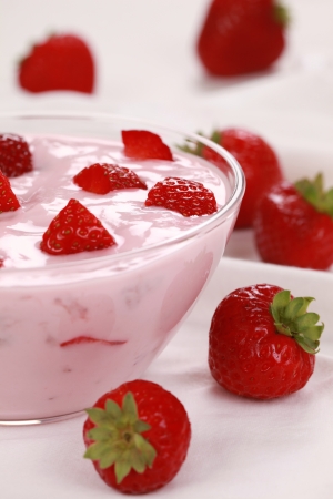 Strawberry yogurt served with delicious strawberries in a glass bowlの写真素材