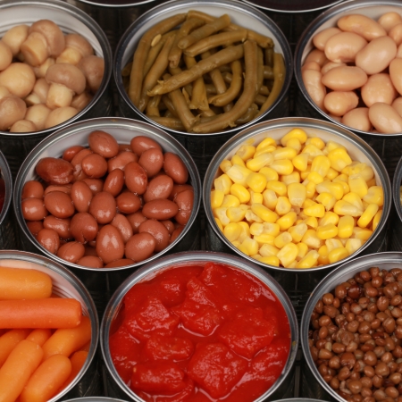 Collection of canned vegetables such as corn, peas, beans and tomatoesの写真素材