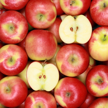 Group of red apples forming a backgroundの写真素材