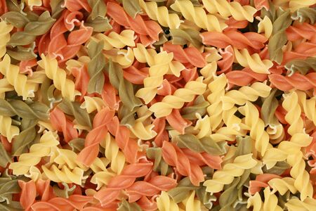 Colorful italian Pasta forming a noodle backgroundの写真素材